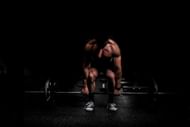 Barbell row (Photo via Unsplash/Anastase Maragos)
